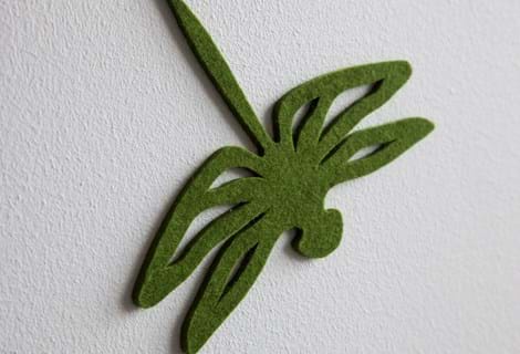 Fraster filt udskåret som guldsmed opklæbet på væg